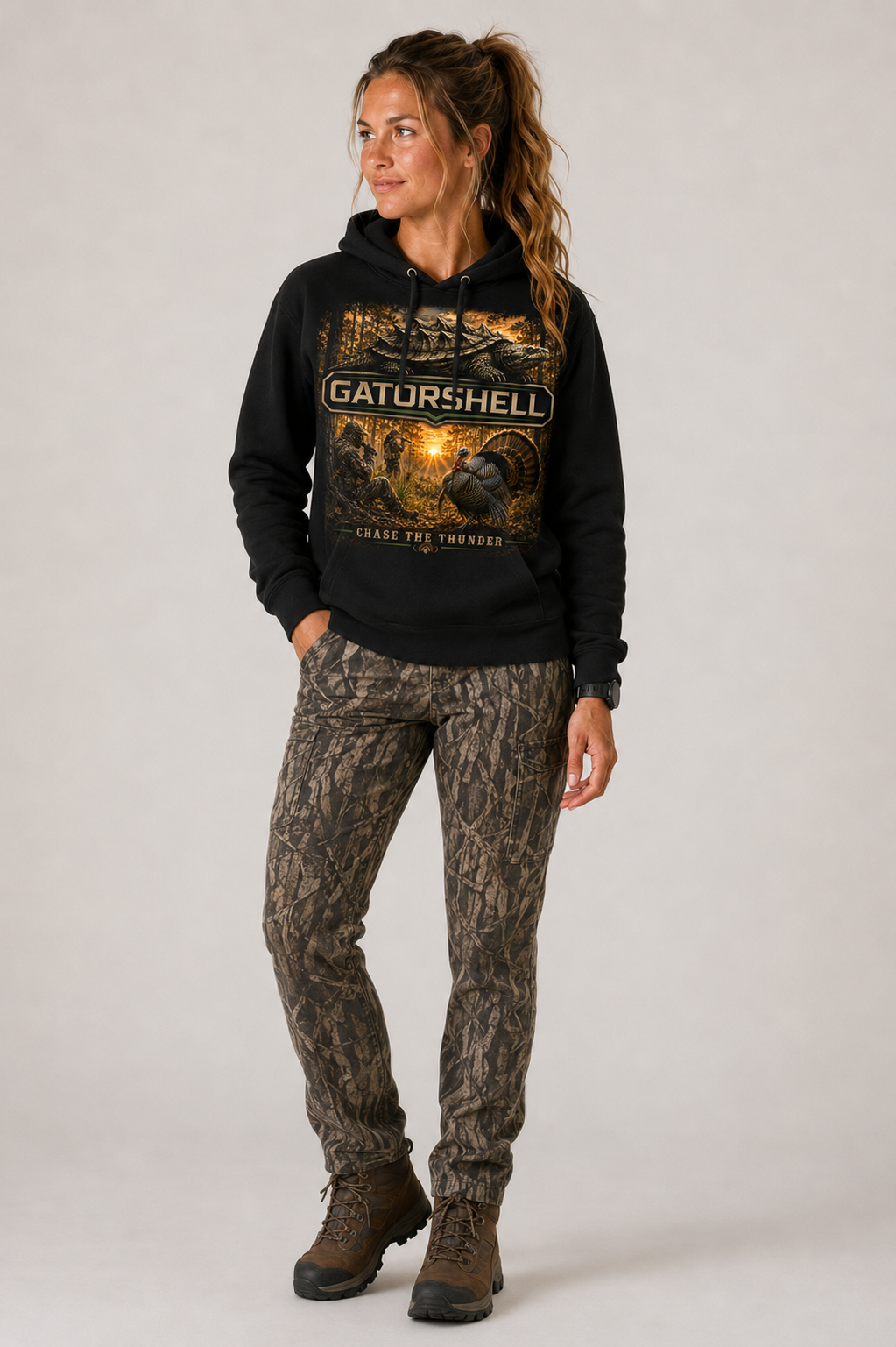 Female model wearing black GatorShell Turkey Hunting hoodie