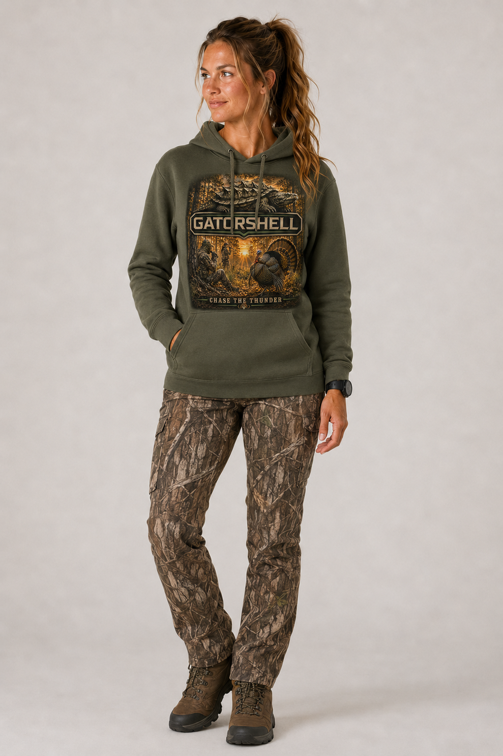 Female model wearing military green GatorShell Turkey Hunting hoodie